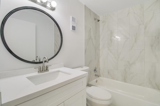 full bathroom featuring vanity, toilet, and tiled shower / bath