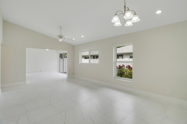 unfurnished room featuring lofted ceiling and ceiling fan with notable chandelier