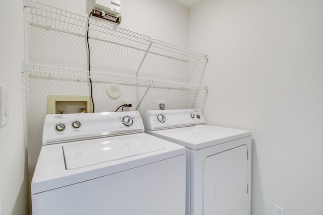 washroom with washer and dryer