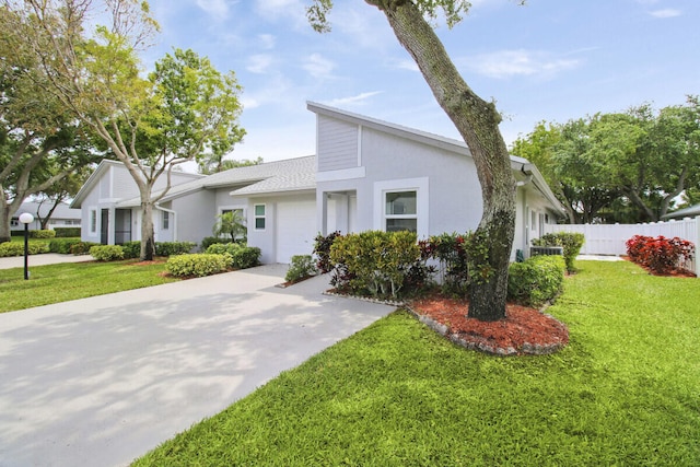 view of front facade with a garage and a front lawn