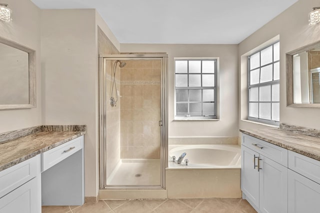 bathroom with vanity, plus walk in shower, and tile patterned floors