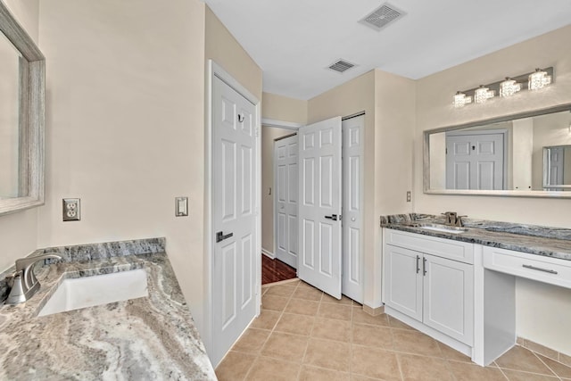 bathroom with vanity and tile patterned floors