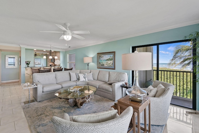 living room with ceiling fan, ornamental molding, and light tile patterned floors