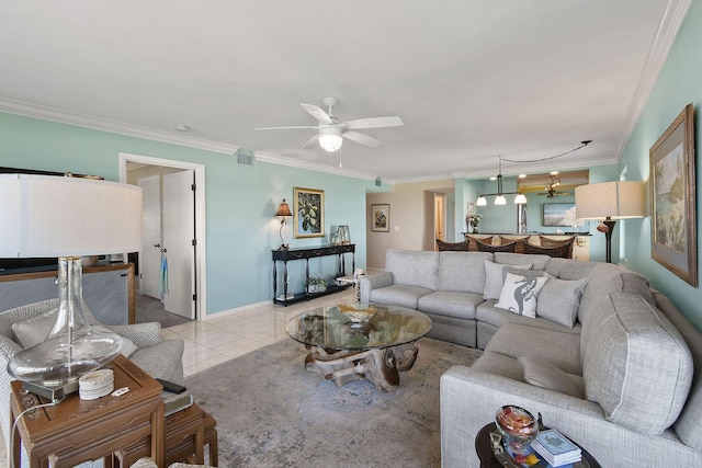 2571 NE Ocean Blvd Unit 10-203, Stuart, FL 34996 - living room with crown molding, a ceiling fan, light tile patterned floors, and baseboards
