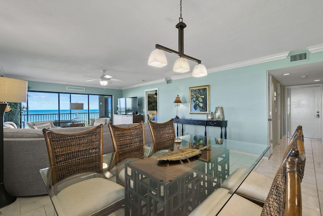 2571 NE Ocean Blvd Unit 10-203, Stuart, FL 34996 - dining space featuring crown molding, a ceiling fan, light tile patterned flooring, and baseboards