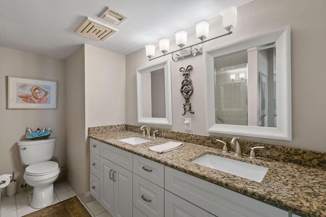 2571 NE Ocean Blvd Unit 10-203, Stuart, FL 34996 - bathroom featuring toilet, tile patterned floors, and double vanity