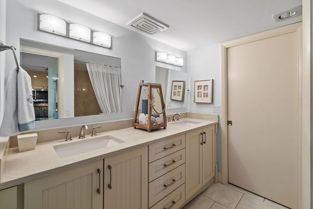 bathroom featuring vanity and tile patterned floors