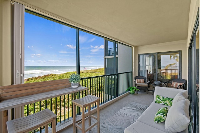 2571 NE Ocean Blvd Unit 10-203, Stuart, FL 34996 - sunroom / solarium with view of water and beach and healthy amount of natural light