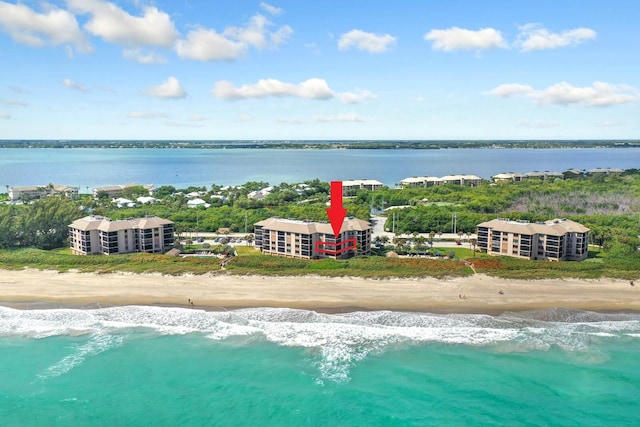 aerial view with a view of the beach and a water view