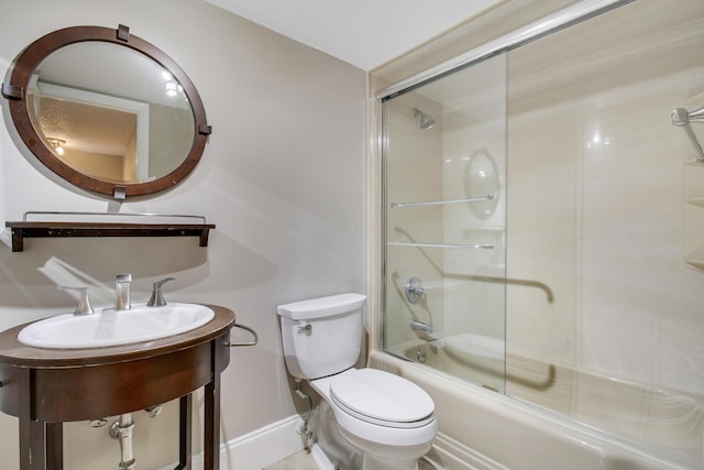 bathroom with bath / shower combo with glass door and toilet