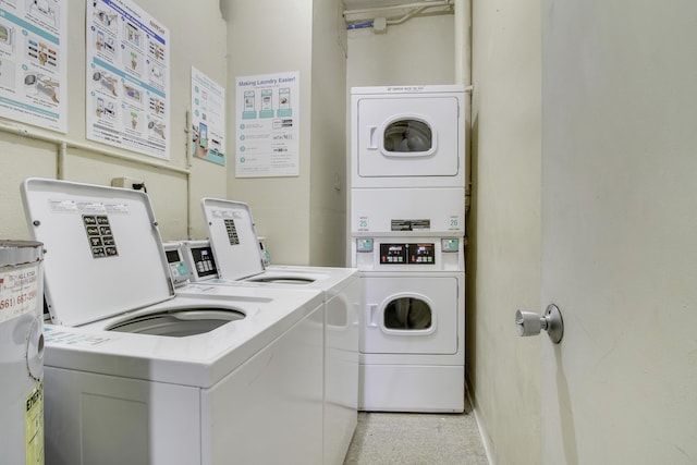 shared laundry area featuring stacked washer / dryer and washer and dryer