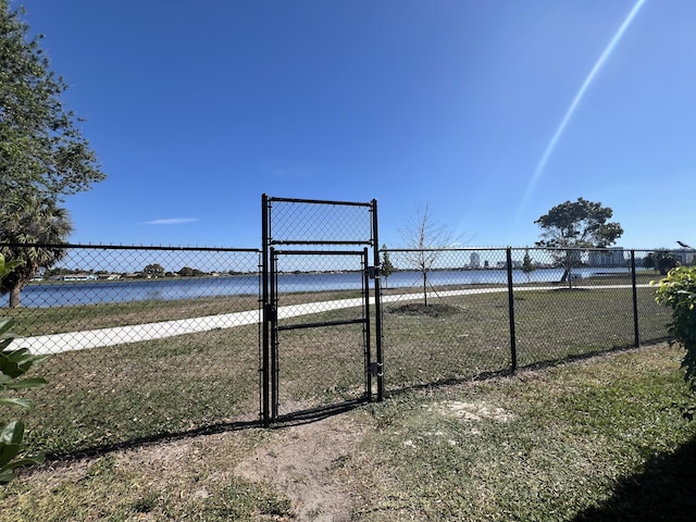 view of community featuring fence and a gate