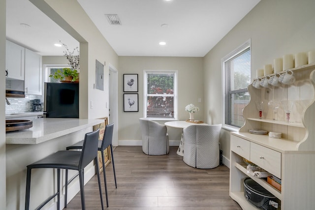 dining area with dark wood-type flooring