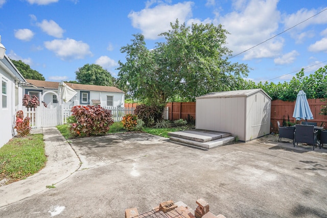 view of patio with a shed