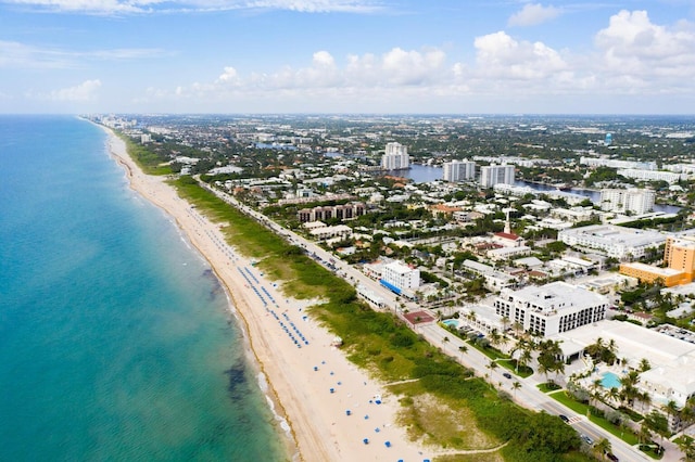 drone / aerial view featuring a view of the beach and a water view