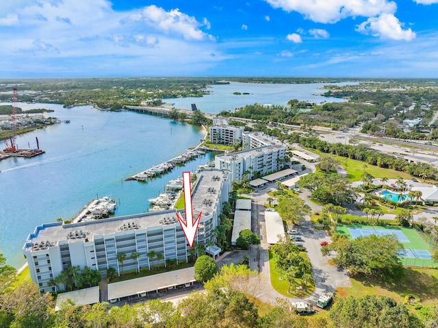 birds eye view of property with a water view