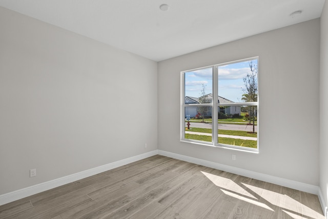 12501 SW Sunrise Lake Ter, Port Saint Lucie, FL 34987 - unfurnished room featuring light wood-style floors, baseboards, and a smoke detector