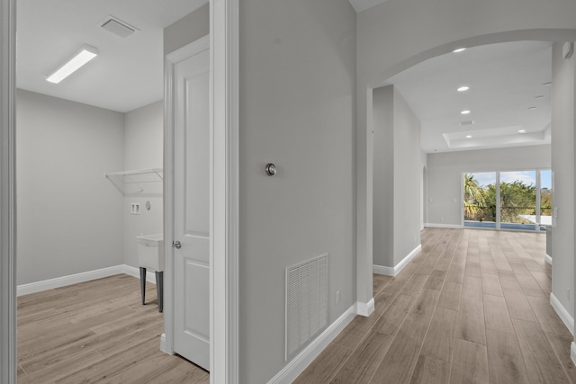 12501 SW Sunrise Lake Ter, Port Saint Lucie, FL 34987 - corridor featuring arched walkways, light wood-style flooring, baseboards, and recessed lighting