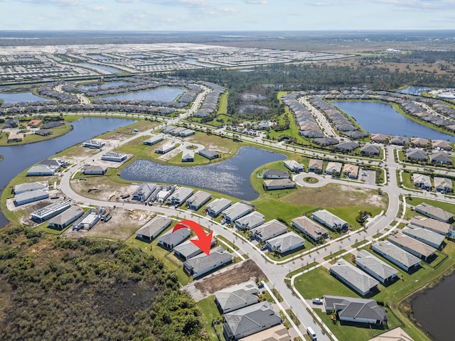 12501 SW Sunrise Lake Ter, Port Saint Lucie, FL 34987 - aerial view of property and surrounding area with a large body of water and nearby suburban area