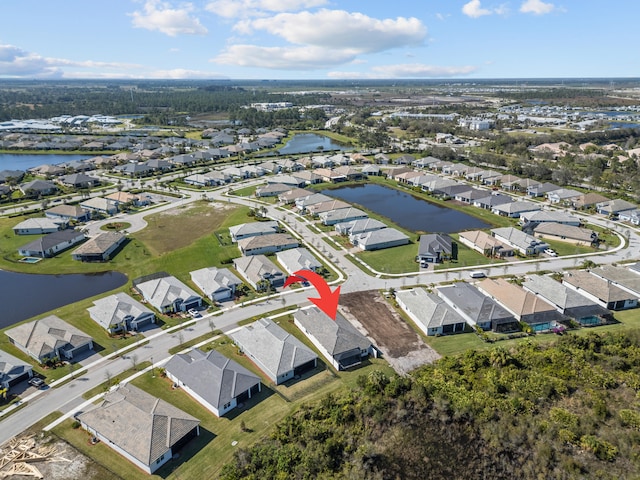 12501 SW Sunrise Lake Ter, Port Saint Lucie, FL 34987 - aerial view of property and surrounding area featuring nearby suburban area and a large body of water