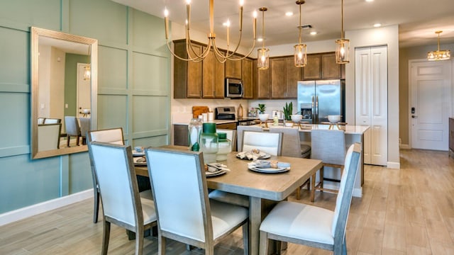 dining area featuring light wood-type flooring