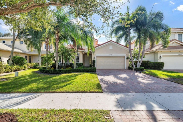 view of front facade with a front lawn and a garage