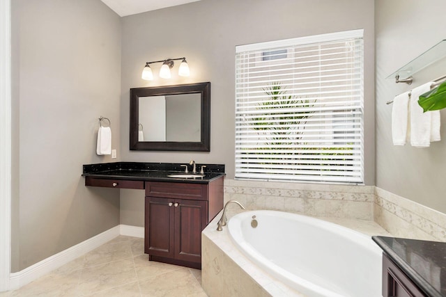 bathroom with tile patterned floors, vanity, and a relaxing tiled tub