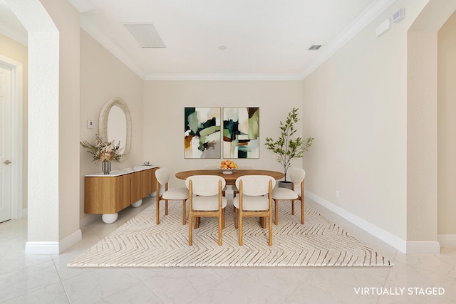 dining room with crown molding