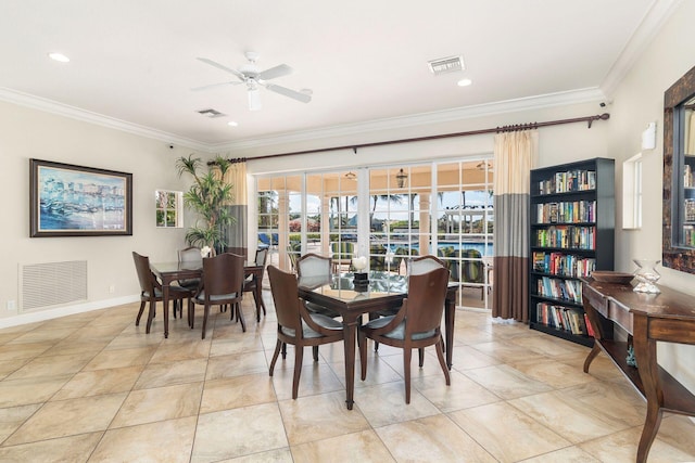 dining area with ceiling fan and ornamental molding