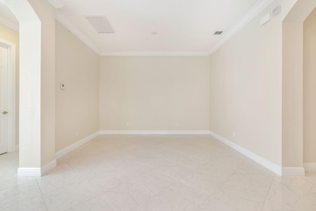 unfurnished room with ornamental molding