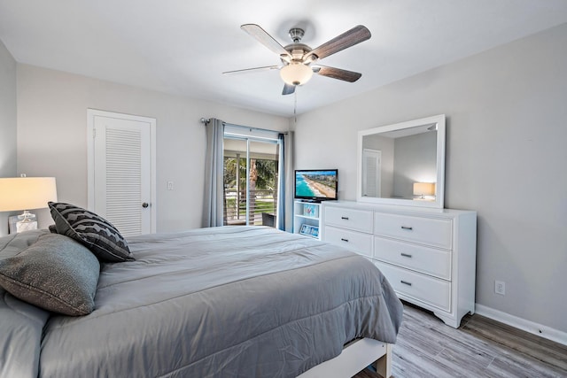 bedroom with a closet, ceiling fan, and light hardwood / wood-style flooring