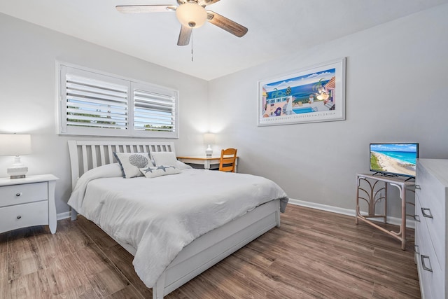 bedroom featuring dark hardwood / wood-style floors and ceiling fan