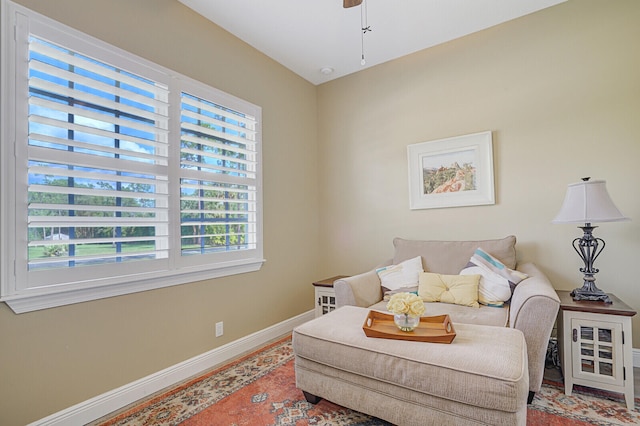 sitting room featuring a wealth of natural light and ceiling fan