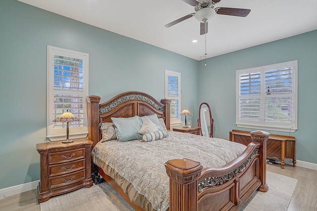 bedroom with light wood-type flooring and ceiling fan