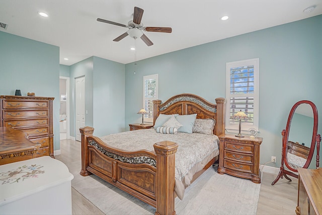 bedroom featuring multiple windows, a closet, light wood-type flooring, and ceiling fan