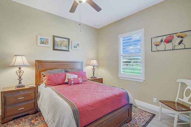 bedroom featuring ceiling fan and light hardwood / wood-style floors