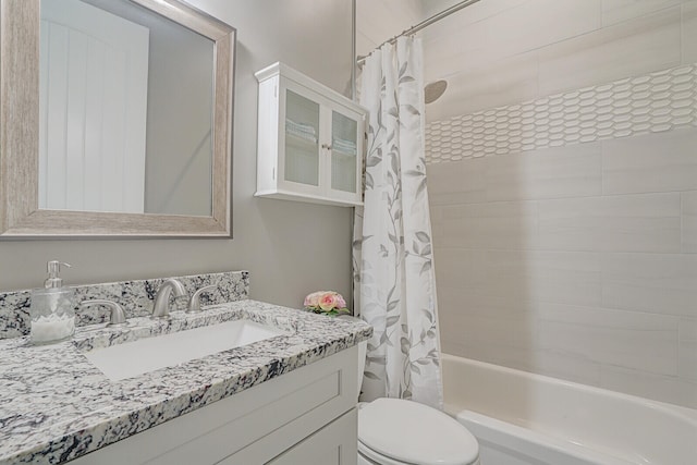 full bathroom featuring vanity, toilet, and shower / bath combo with shower curtain