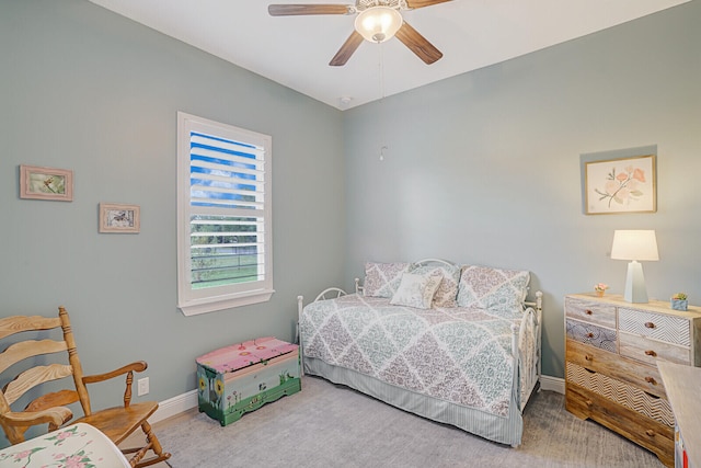 bedroom featuring ceiling fan and carpet