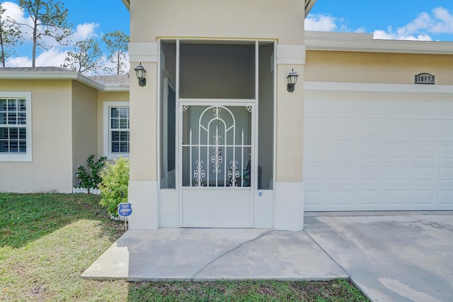 doorway to property featuring a garage