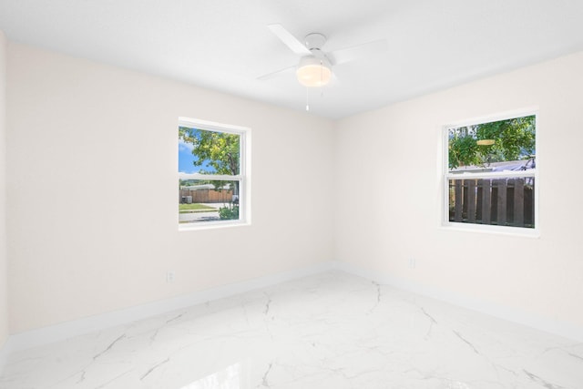 spare room with ceiling fan