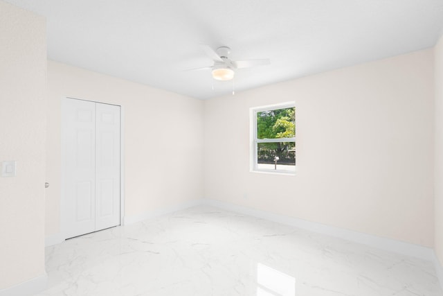 unfurnished room with ceiling fan