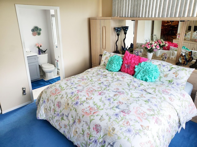 carpeted bedroom with ensuite bath