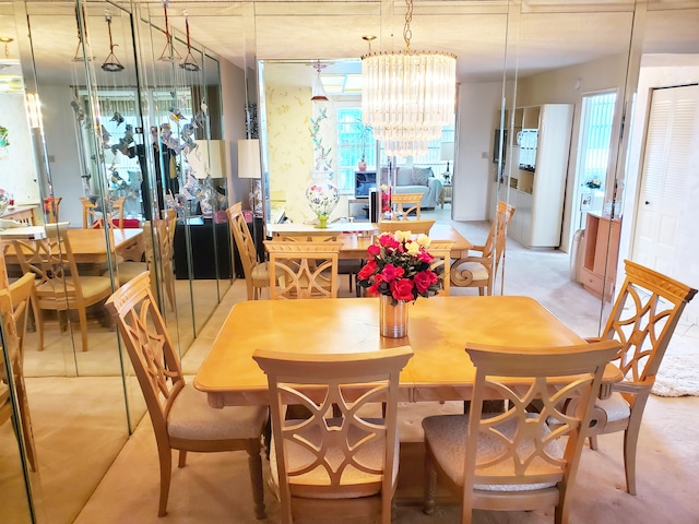 dining space with an inviting chandelier