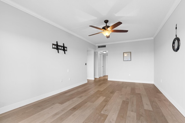 spare room with light hardwood / wood-style flooring, ceiling fan, and crown molding