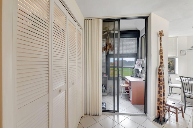 corridor with light tile patterned flooring