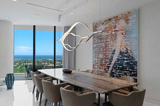 dining room with floor to ceiling windows, a wealth of natural light, and light tile patterned floors