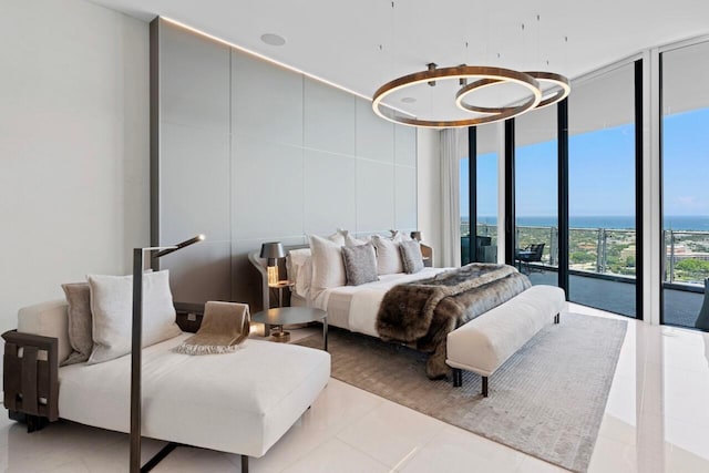 bedroom featuring floor to ceiling windows, a water view, access to outside, and light tile patterned flooring