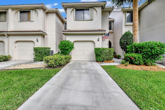 6366 Longboat Ln Unit G104, Boca Raton, FL 33433 - multi unit property with stucco siding, a garage, concrete driveway, and a front yard