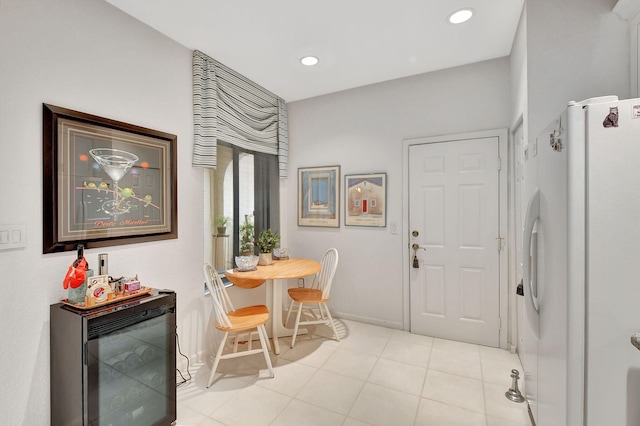 interior space featuring wine cooler and light tile patterned flooring