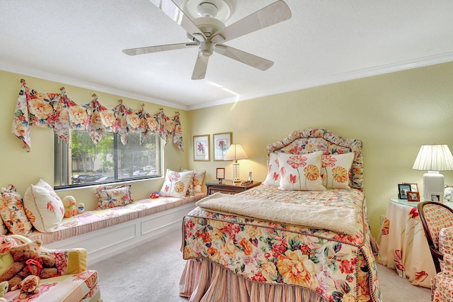 carpeted bedroom with ceiling fan, crown molding, and a textured ceiling